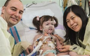 Hannah receives a visit from her parents at the Children's Hospital of Illinois in Peoria after receiving a new windpipe using her own adult stem cells.